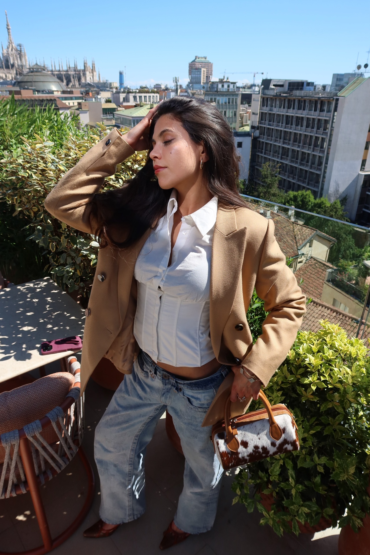 Personal styling — camel blazer, white corset, Milan rooftop