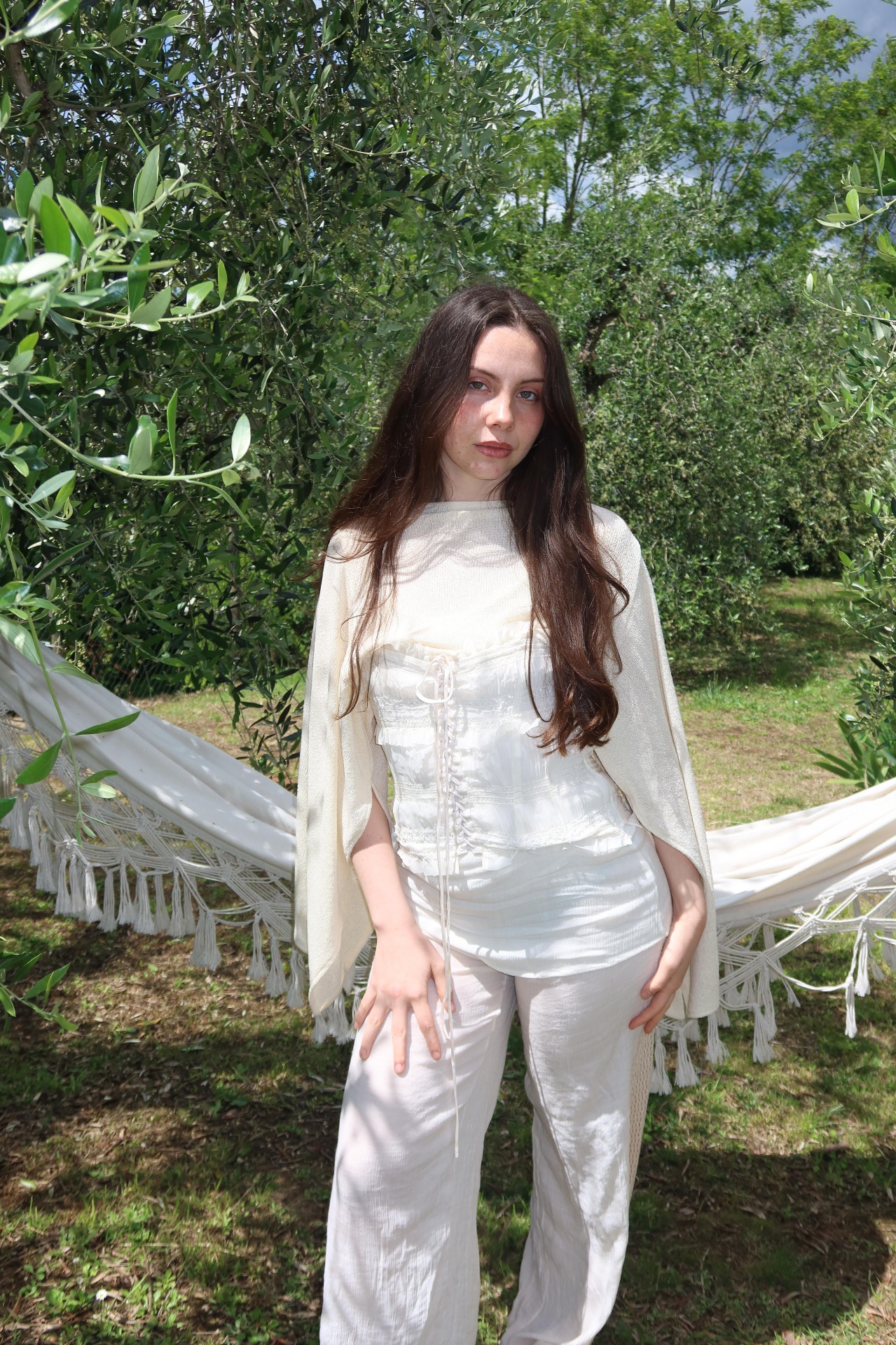 Garden of Eden — standing at the hammock, corset and cream knit
