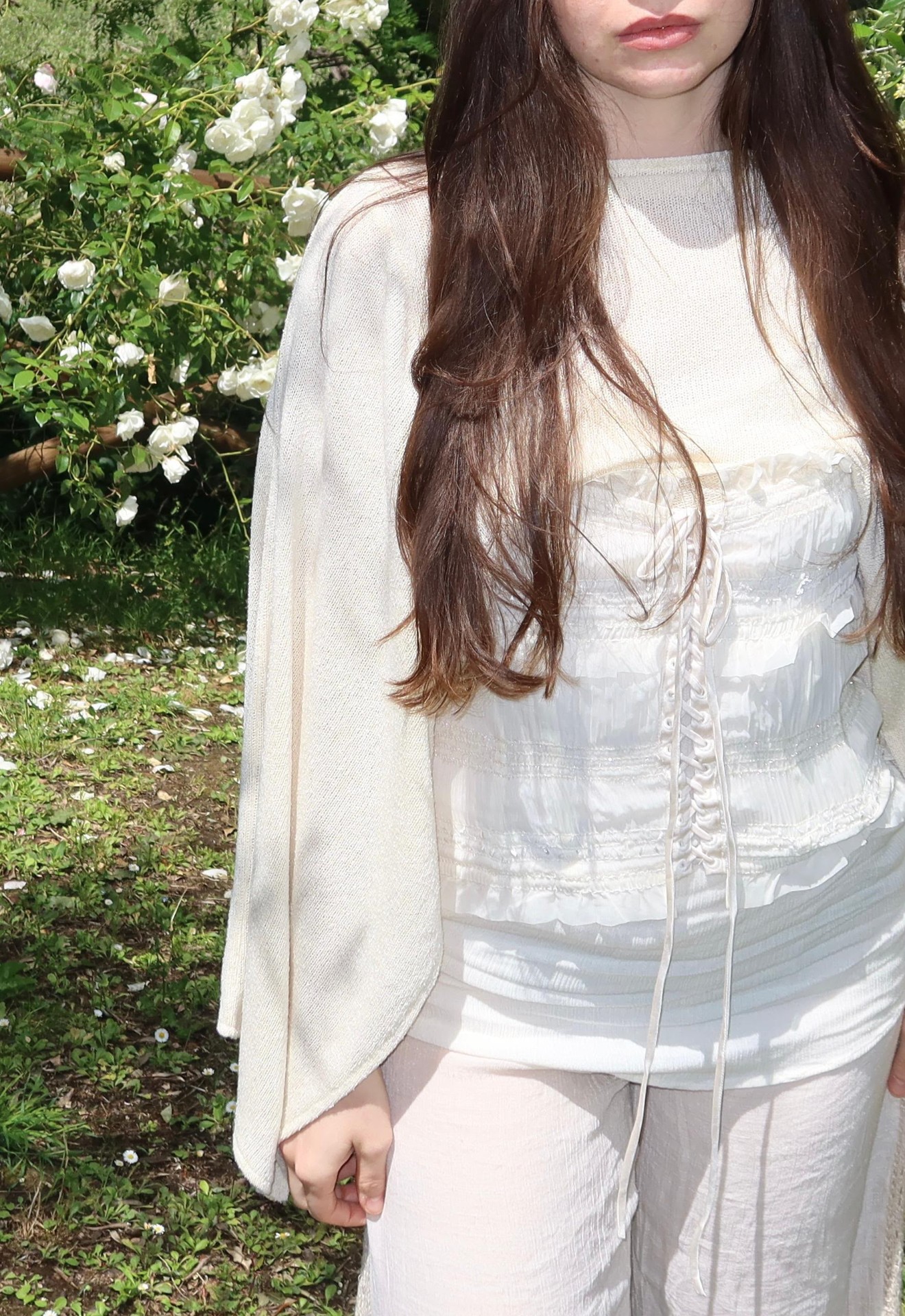 Garden of Eden — close-up, white lace-up corset and cream knit