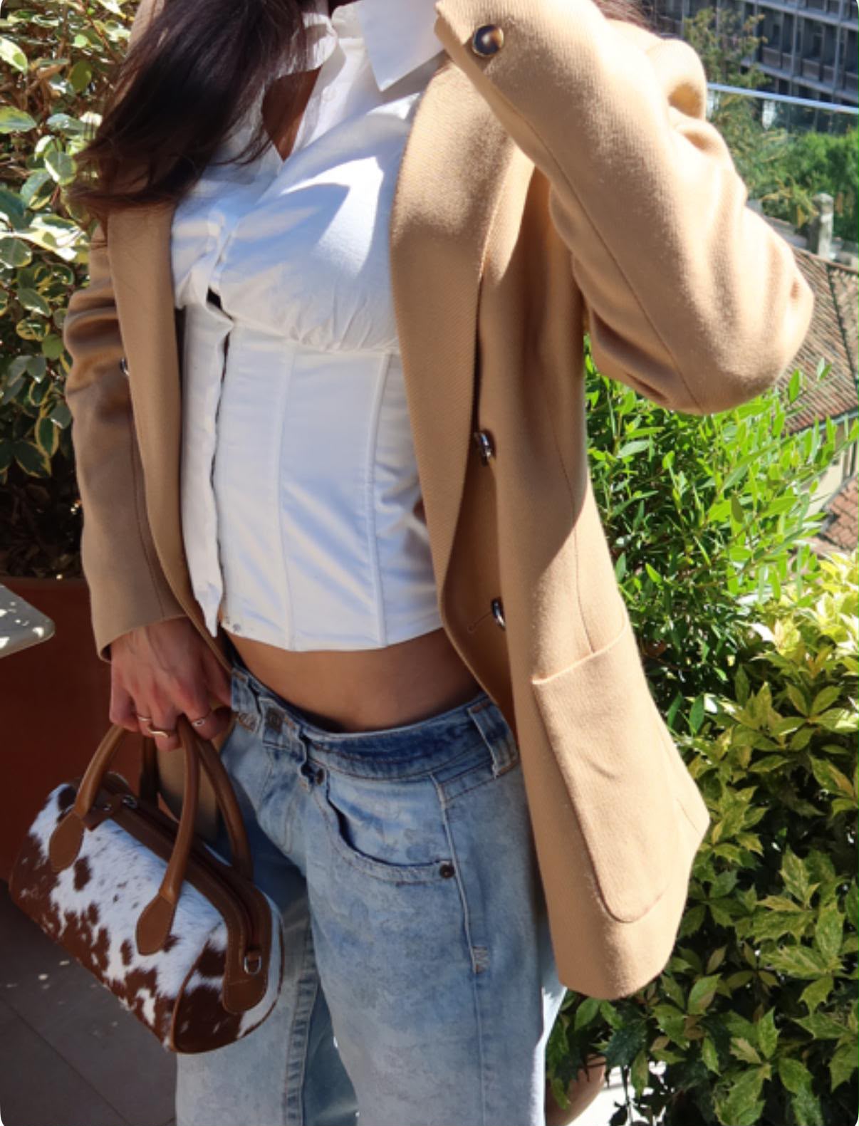 Personal styling — corset detail with camel blazer and cow-print bag